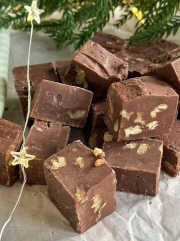 Easy chocolate walnut fudge made in the microwave with sweetened condensed milk, cut into squares.