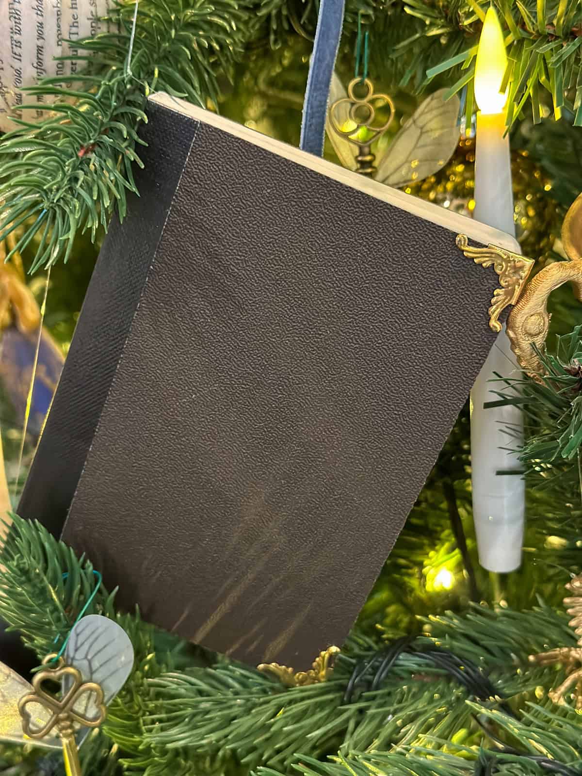 DIY Tom Riddle's diary Horcrux ornament on a Harry Potter Christmas tree.