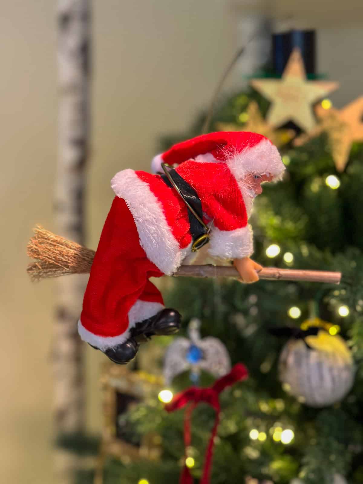 Motorized Santa flying on broom tree topper for Harry Potter themed Christmas tree decorations.
