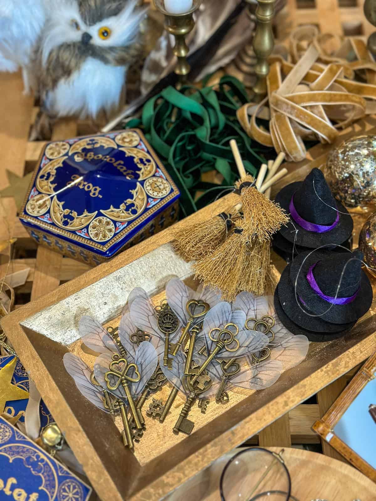 Flying keys ornaments with wings in gold tray for homemade Harry Potter Christmas decorations.