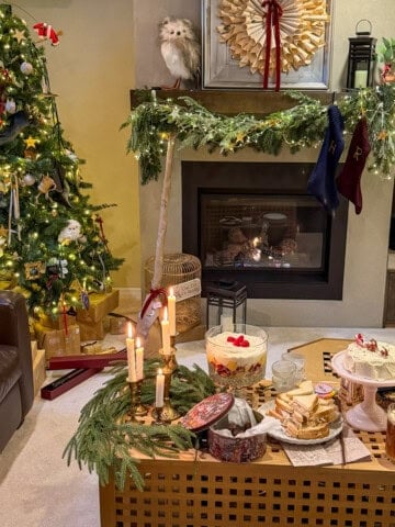 Harry Potter Christmas party with food from the first book, set up by the fireplace and Christmas tree.