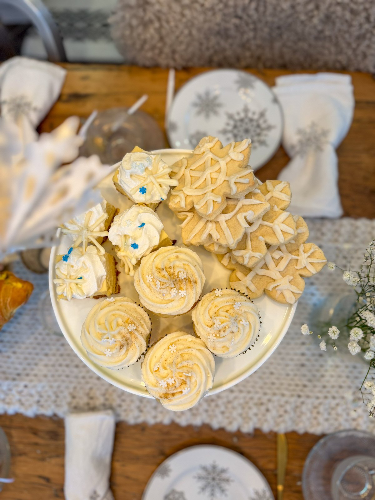 Plate of snow themed desserts for a winter tea party.