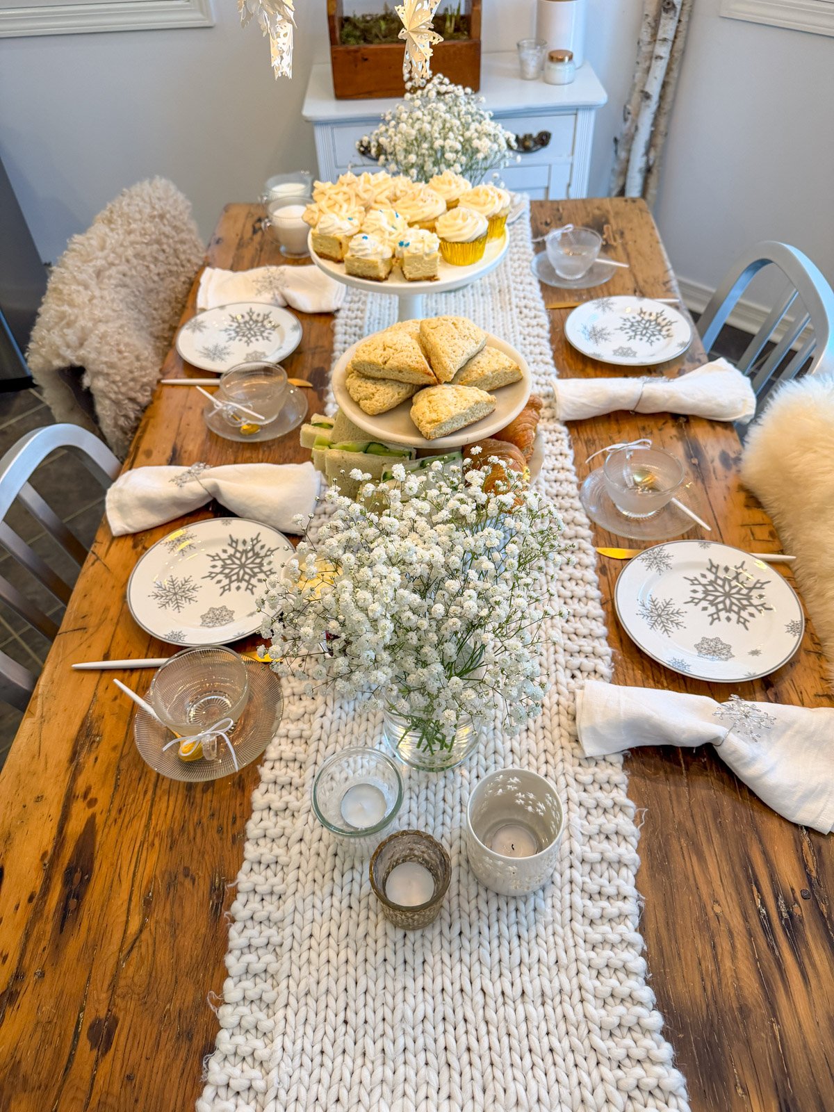 Winter tea party with snow-themed tablescape.