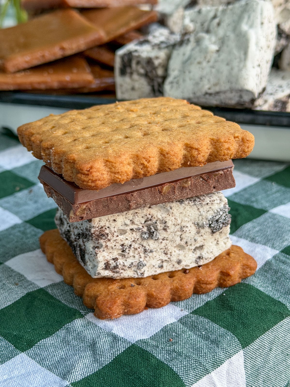 Stack of graham cracker crack, chocolate, and Oreo marshmallow s'mores.