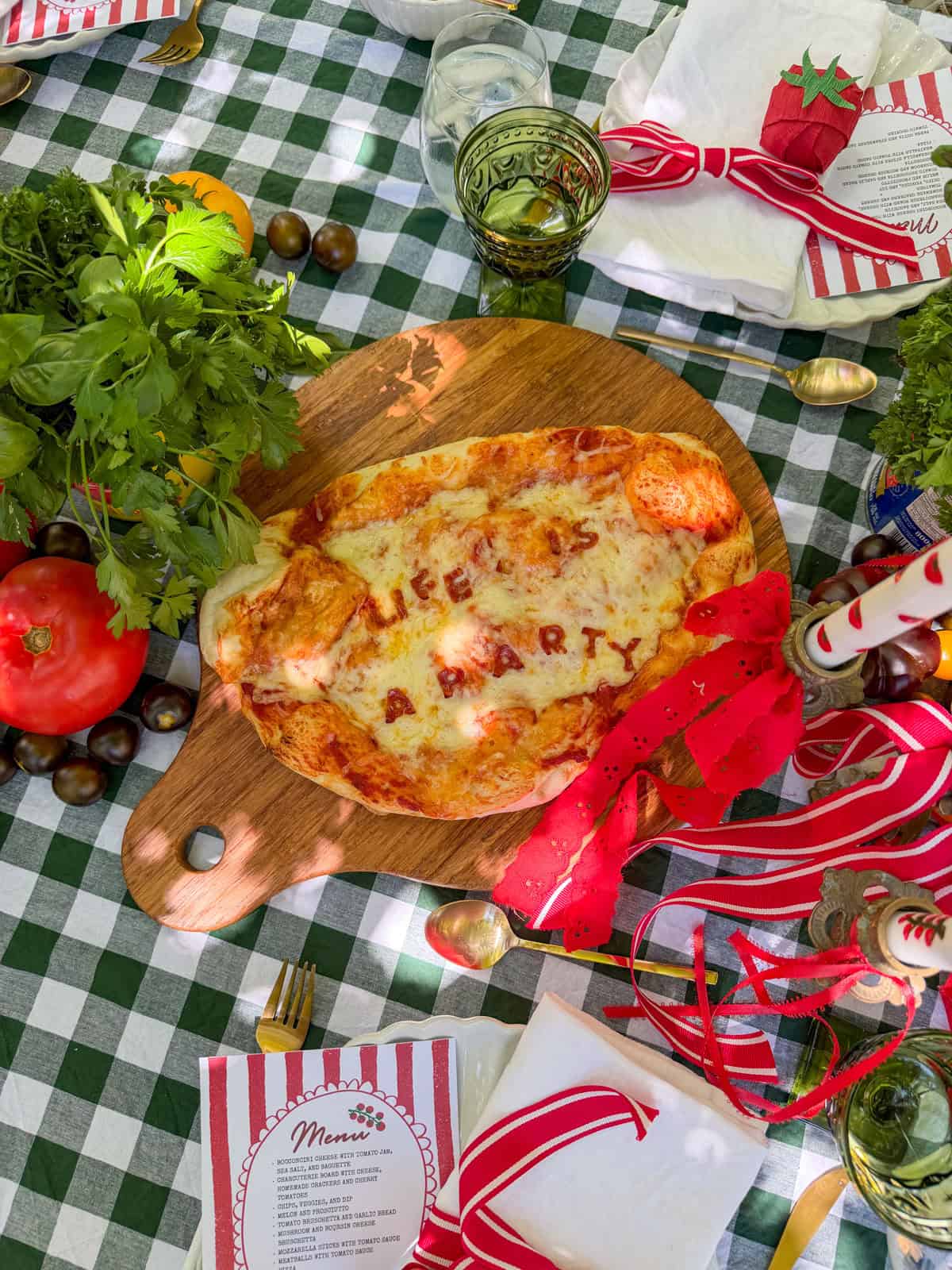 Close up of Life Is a Party pepperoni pizza at a tomato themed party.